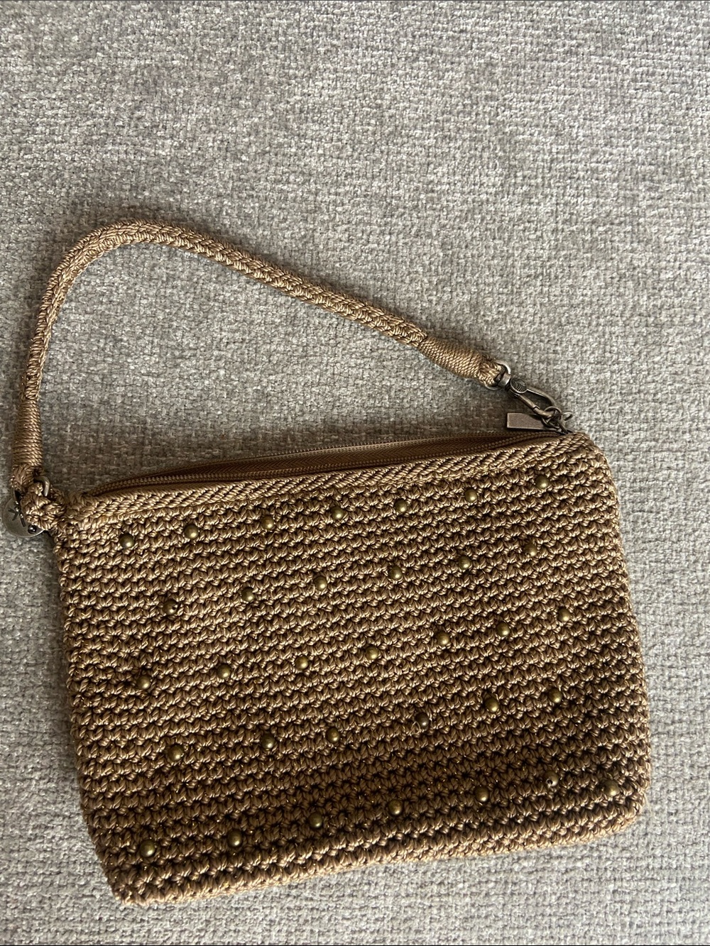 The Sak Woven Wristlet Clutch in Metallic Brown